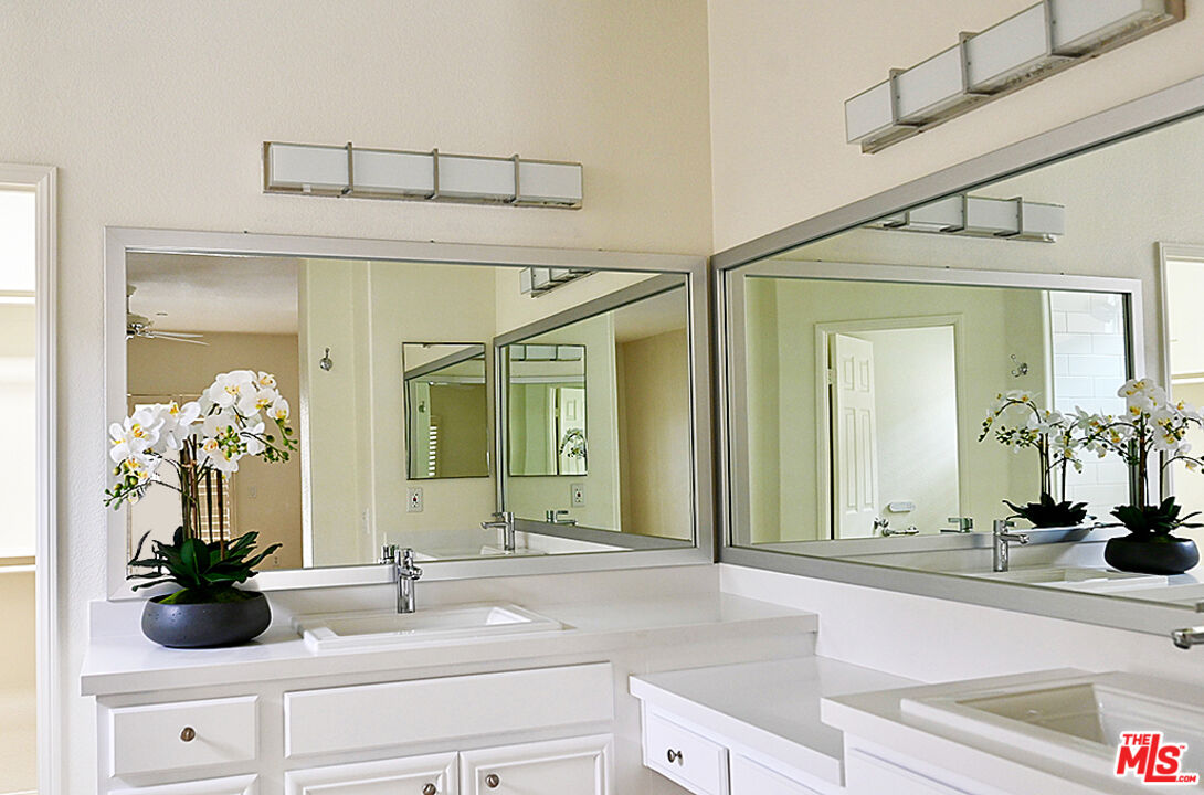 699 Alta Ridge Palm Springs, CA 92262 - Photo 12 of 31 a bathroom with a sink and a mirror