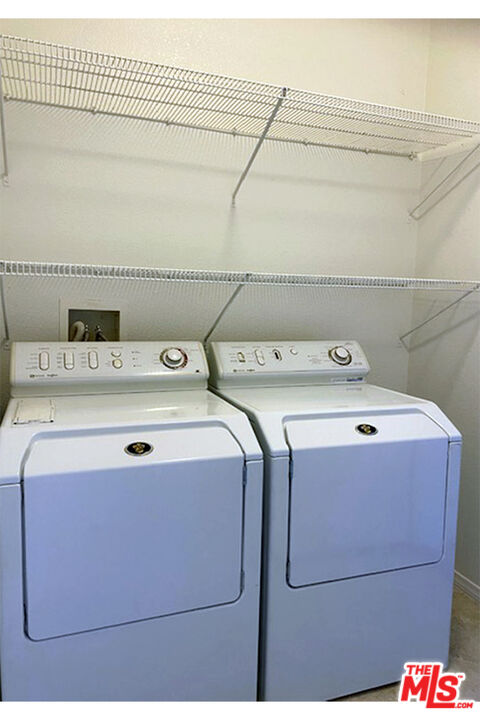 699 Alta Ridge Palm Springs, CA 92262 - Photo 23 of 31 a utility room with washer and dryer