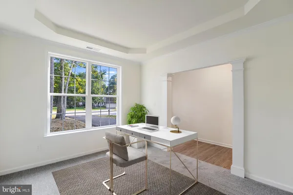 a workspace with furniture and window
