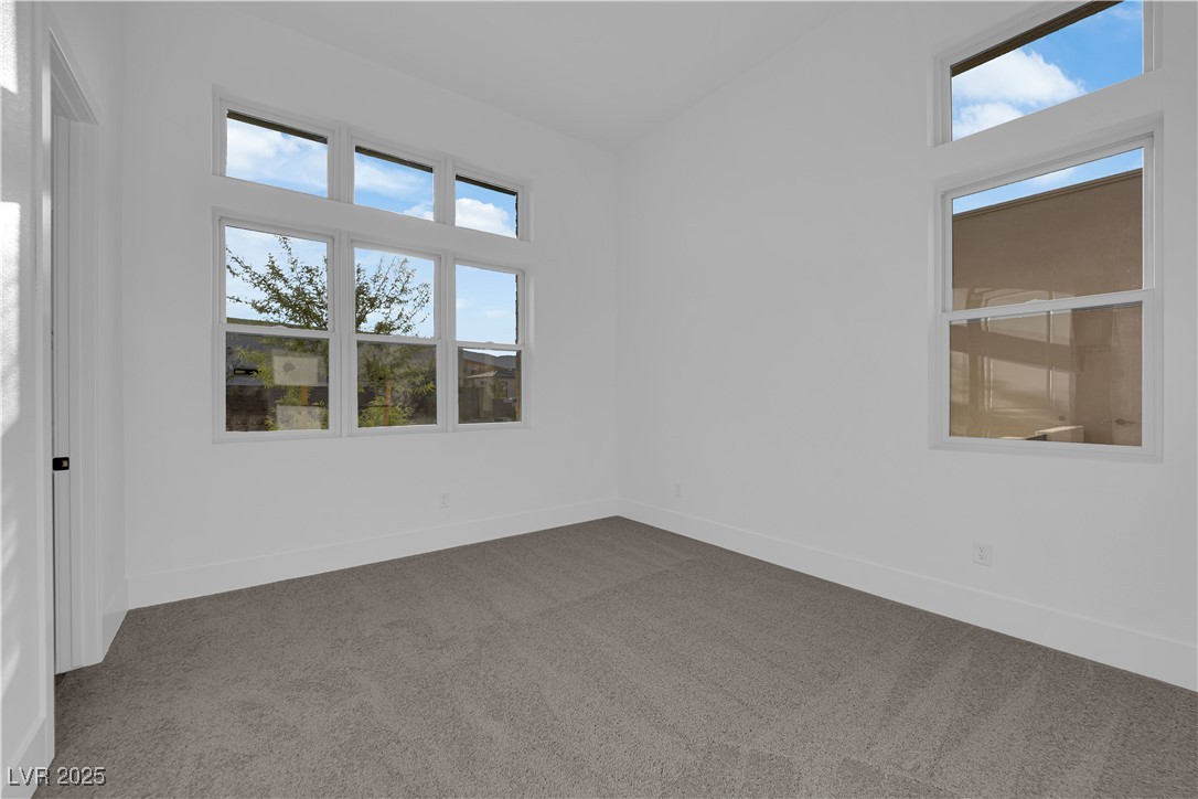 4792 Outlook Peak Street Las Vegas, NV 89135 - Photo 34 of 56 Empty room featuring carpet and baseboards