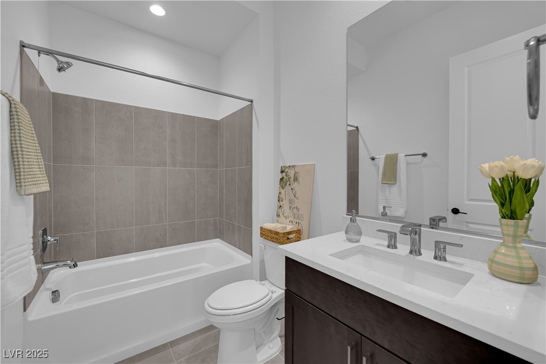 4792 Outlook Peak Street Las Vegas, NV 89135 - Photo 46 of 56 Bathroom featuring bathtub / shower combination, light tile patterned floors, vanity, and recessed lighting