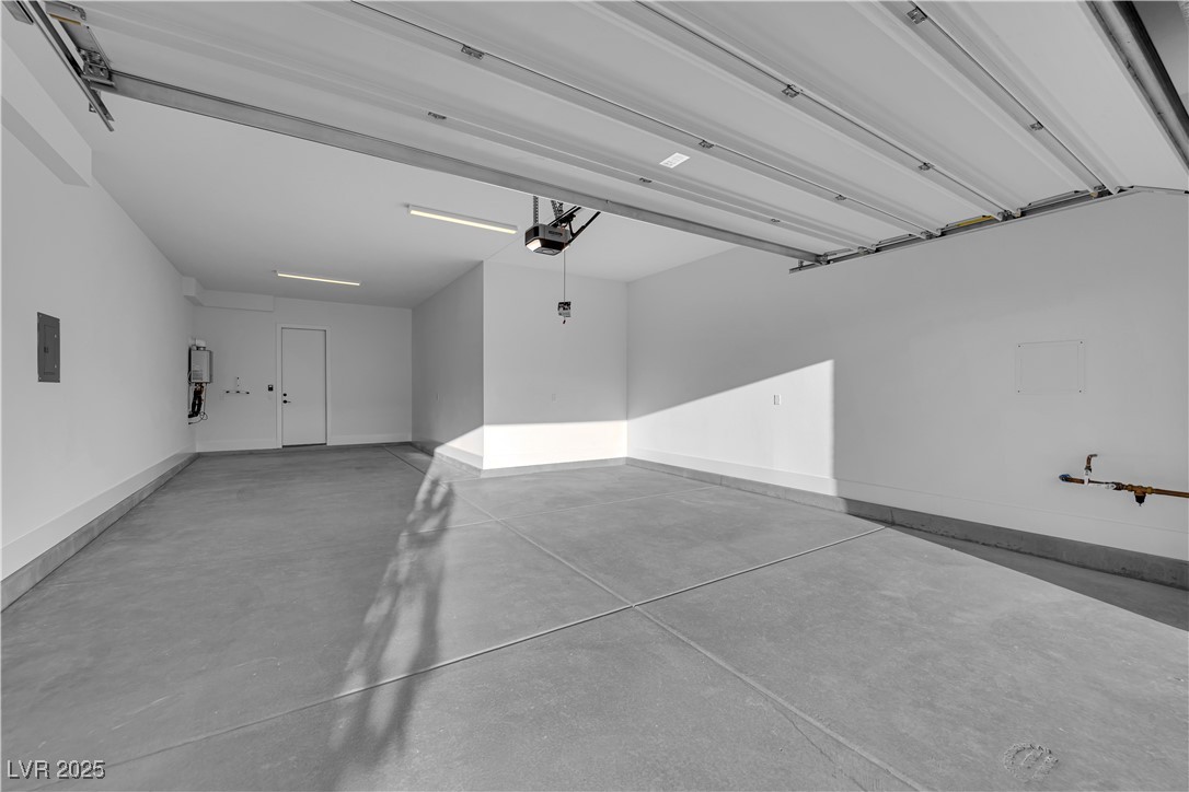 4792 Outlook Peak Street Las Vegas, NV 89135 - Photo 51 of 56 Garage with baseboards and electric panel