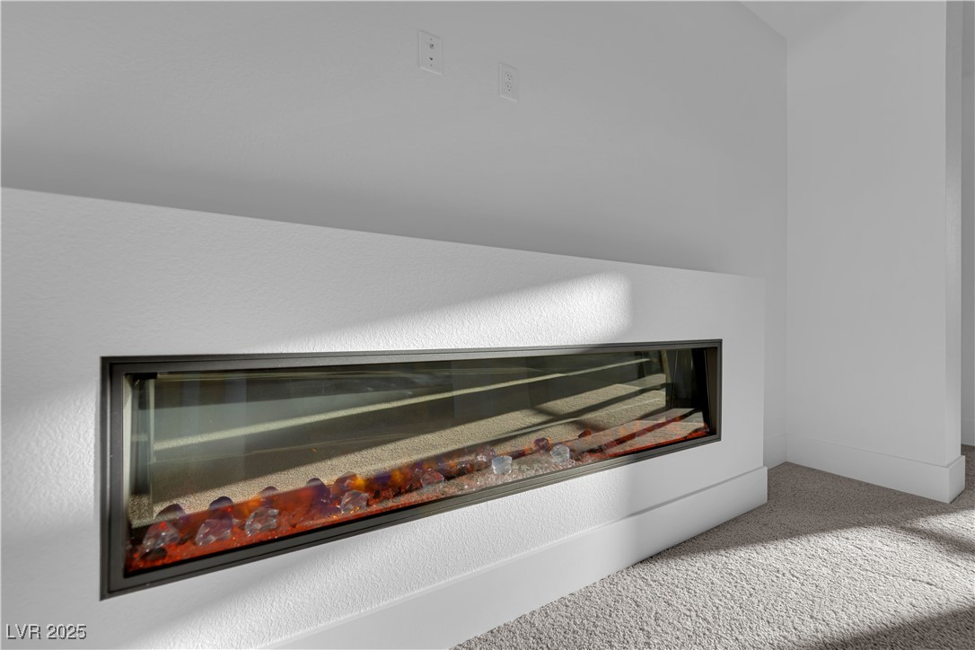 4792 Outlook Peak Street Las Vegas, NV 89135 - Photo 9 of 56 Detailed view of carpet floors and baseboards