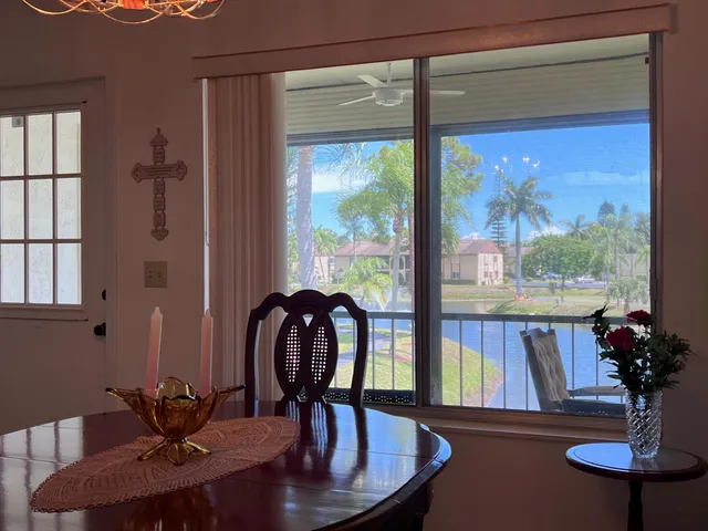 a view of a dining room with furniture wooden floor and a window