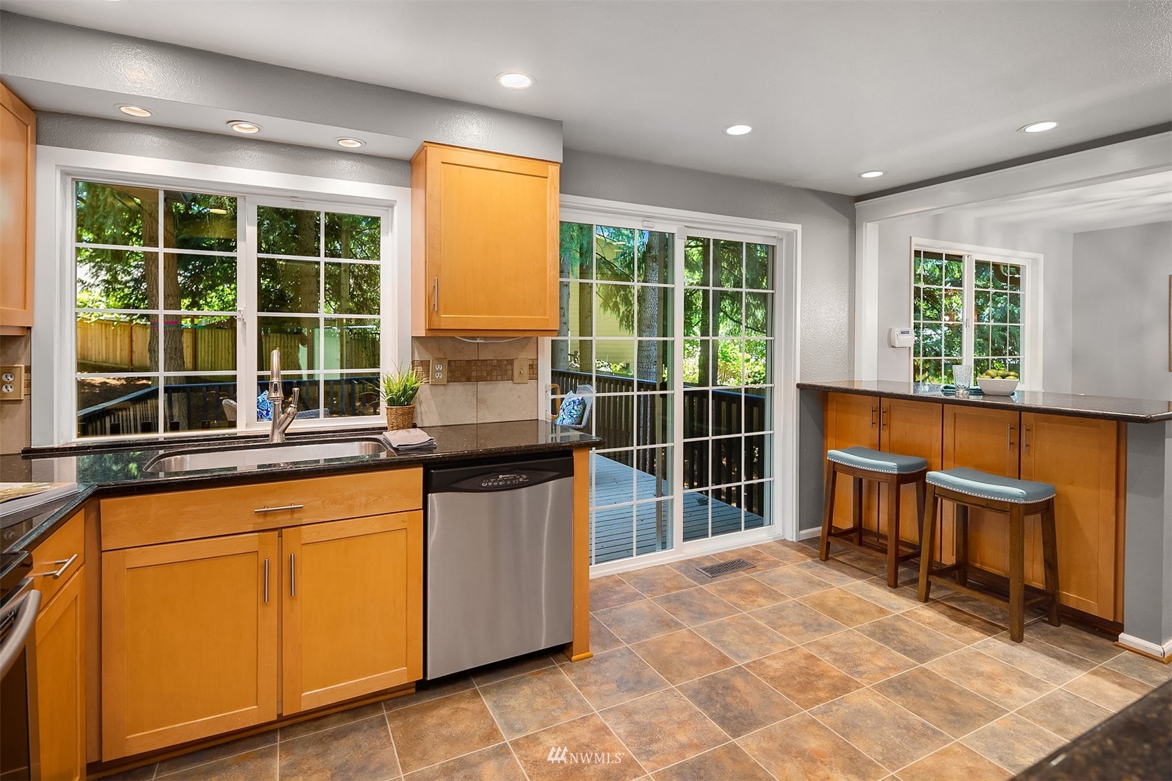 3310 199th Place Southeast Bothell, WA 98012 - Photo 11 of 30 a kitchen with sink a large window and chairs
