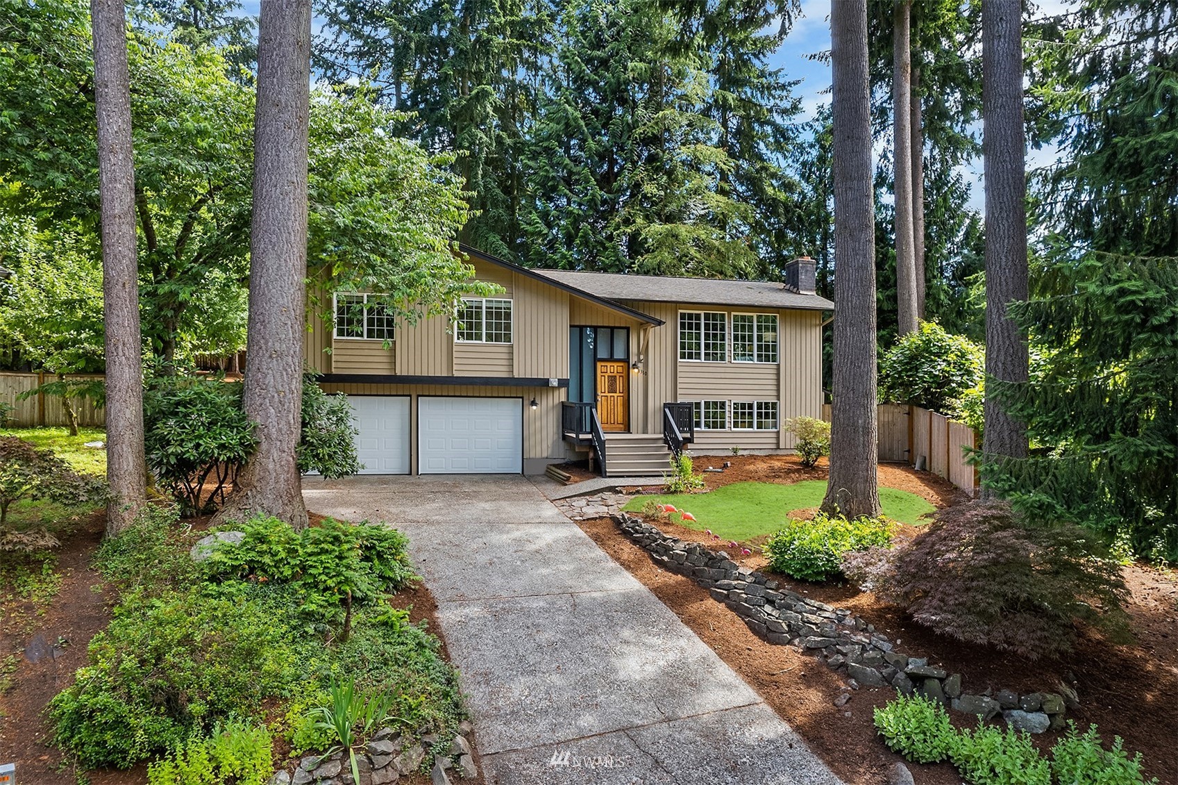 3310 199th Place Southeast Bothell, WA 98012 - Photo 2 of 30 a front view of a house with garden