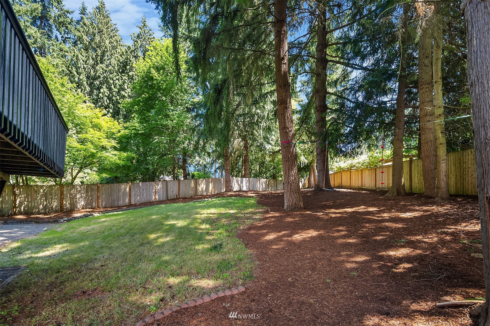 3310 199th Place Southeast Bothell, WA 98012 - Photo 27 of 30 a view of a yard with plants and trees