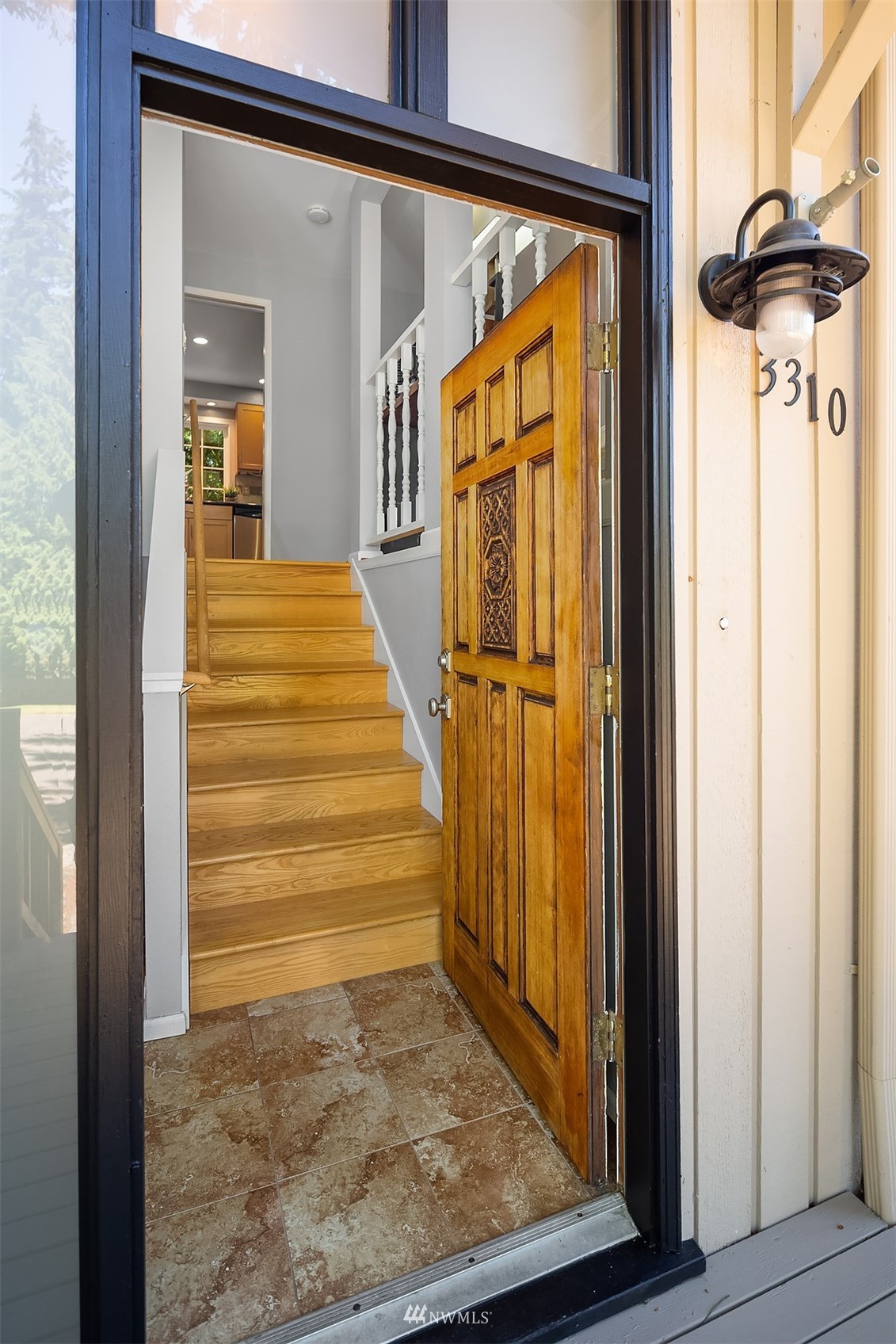 3310 199th Place Southeast Bothell, WA 98012 - Photo 3 of 30 a view of a hallway with wooden floor and staircase