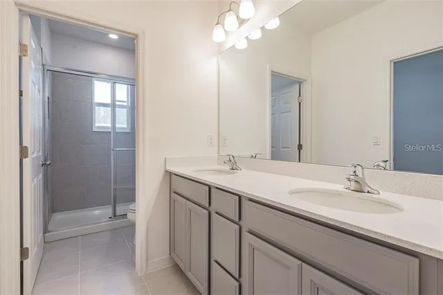 a bathroom with a shower and toilet