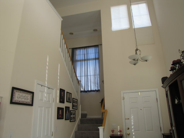 8992 Del Rio Circle Gilroy, CA 95020 - Photo 11 of 19 a view of entryway and hall with wooden floor