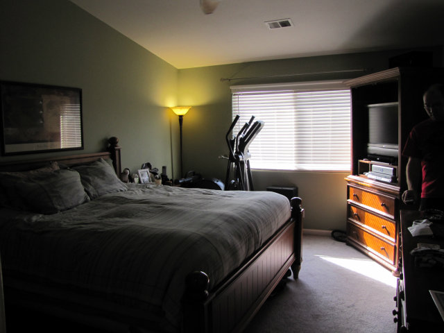 8992 Del Rio Circle Gilroy, CA 95020 - Photo 13 of 19 a bedroom with a bed and a flat tv screen on dresser