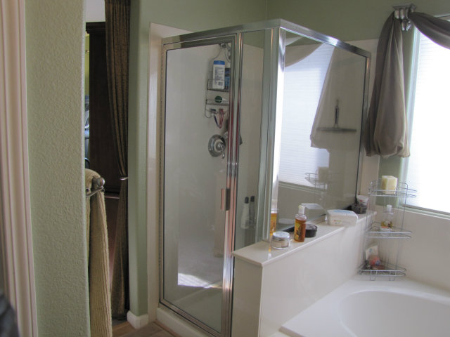 8992 Del Rio Circle Gilroy, CA 95020 - Photo 17 of 19 a bathroom with a tub sink and mirror
