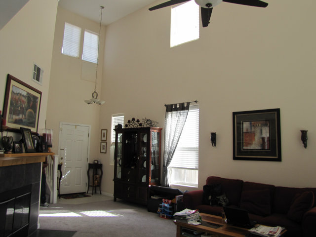8992 Del Rio Circle Gilroy, CA 95020 - Photo 7 of 19 a living room with furniture and a flat screen tv
