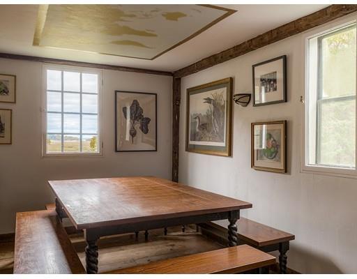 153 Argilla Road Ipswich, MA 01938 - Photo 16 of 27 a room with a table chairs and a window