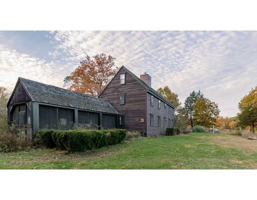 153 Argilla Road Ipswich, MA 01938 - Photo 26 of 27 a black and white house with a yard
