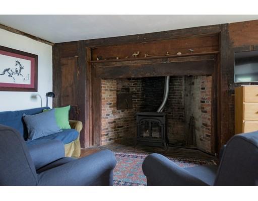 153 Argilla Road Ipswich, MA 01938 - Photo 4 of 27 a living room with furniture and a fireplace