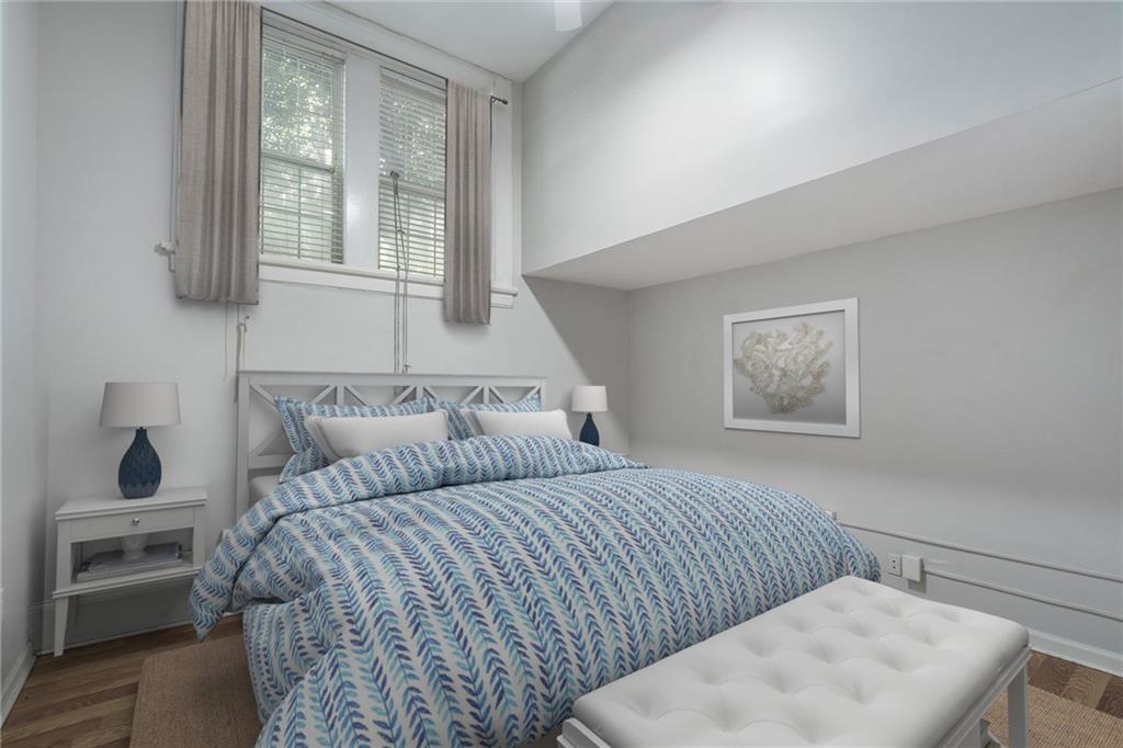 1031 State Street Northwest, Unit 106 Atlanta, GA 30318 - Photo 18 of 23 a bedroom with a bed and a window