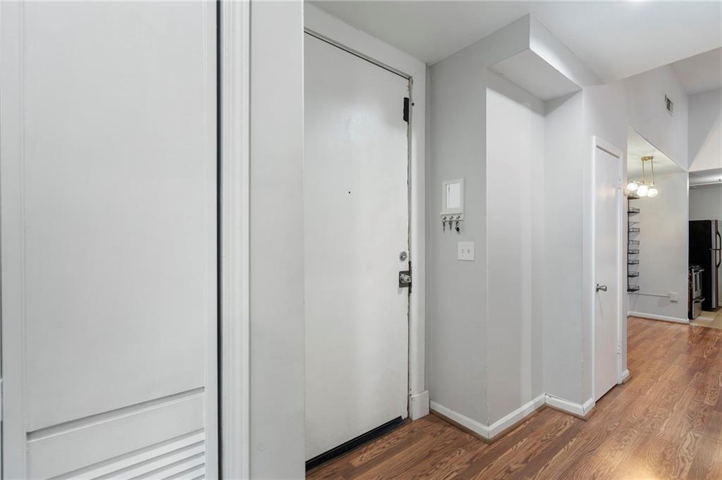 1031 State Street Northwest, Unit 106 Atlanta, GA 30318 - Photo 4 of 23 a view of a hallway with wooden floor