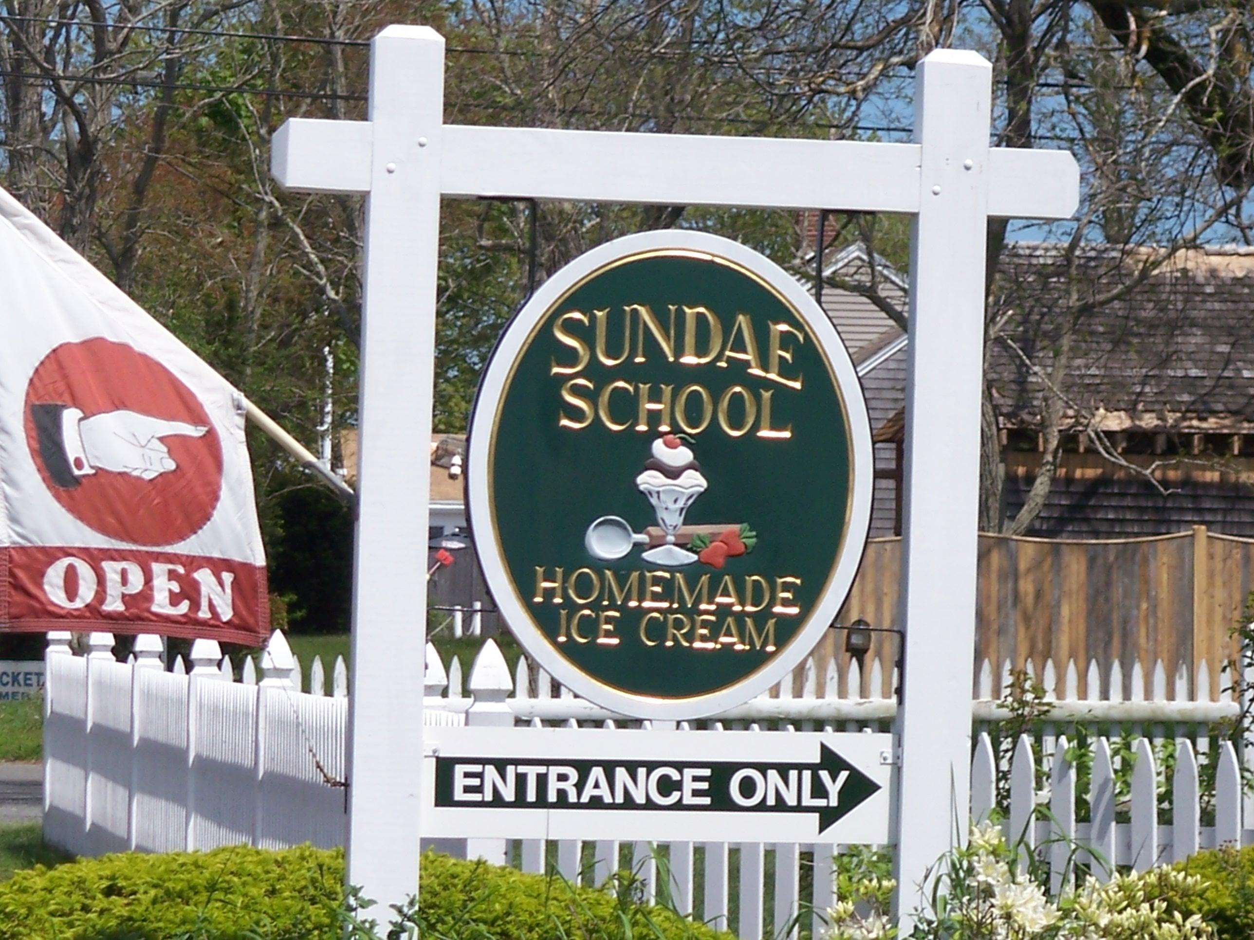 291 Lower County Road, Unit E Dennis Port, MA 02639 - Photo 28 of 31 a sign that is on the side of a building