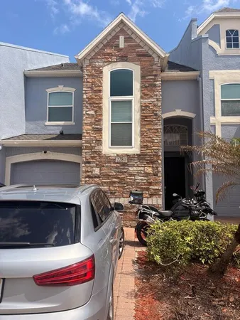 a front view of a house with yard