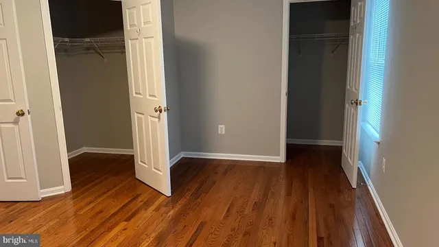 wooden floor in an empty room with a gallery