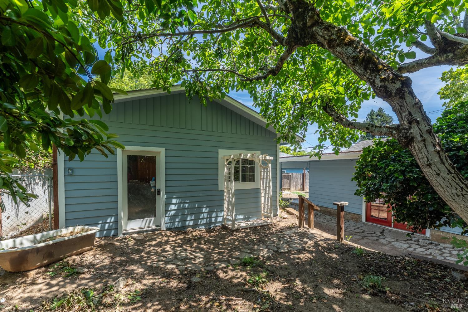262 Magnolia Street Ukiah, CA 95482 - Photo 21 of 34 a backyard of a house with table and chairs