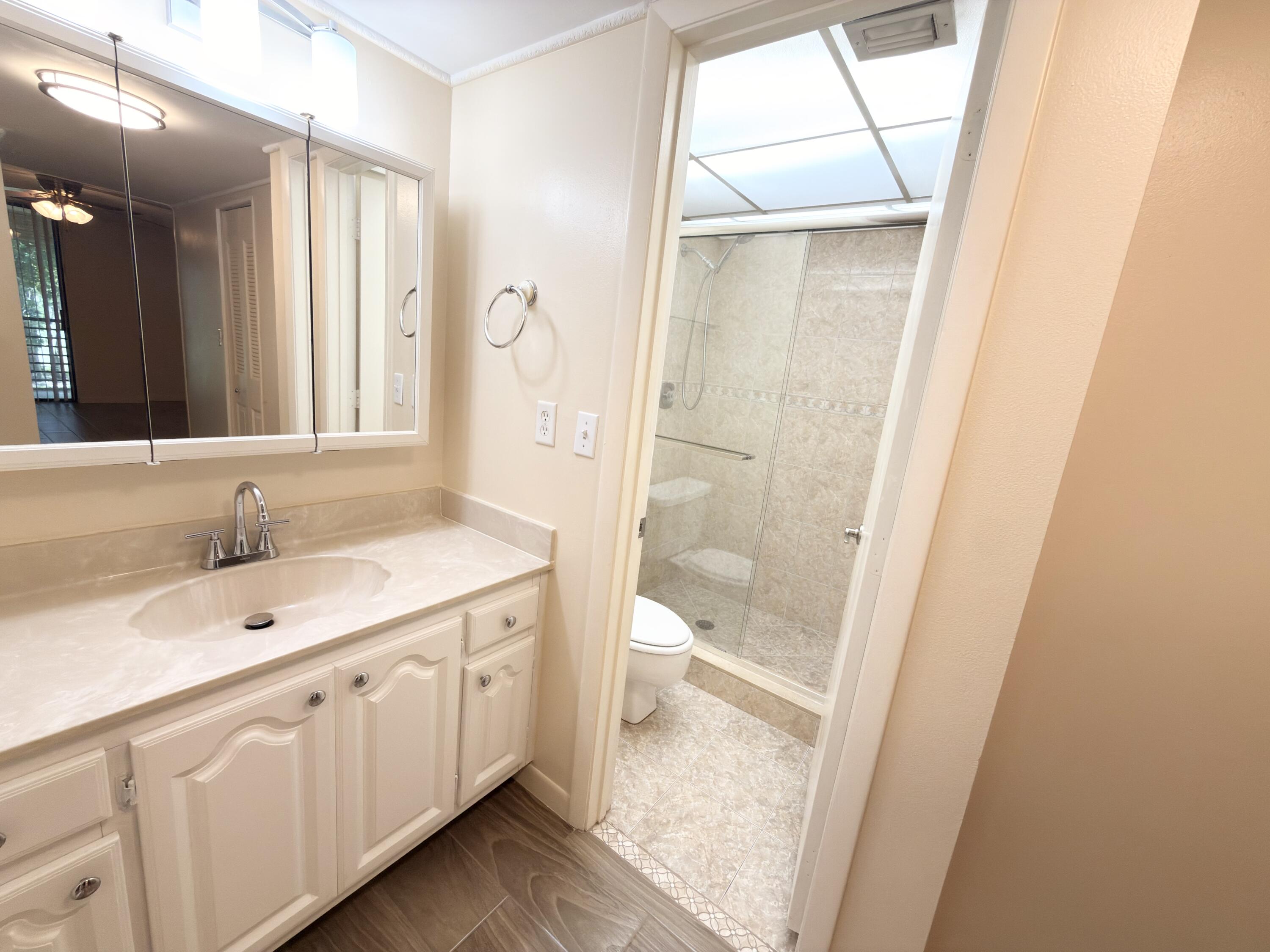 7650 West McNab Road, Unit 210 Tamarac, FL 33321 - Photo 8 of 13 En-Suite Primary Bathroom