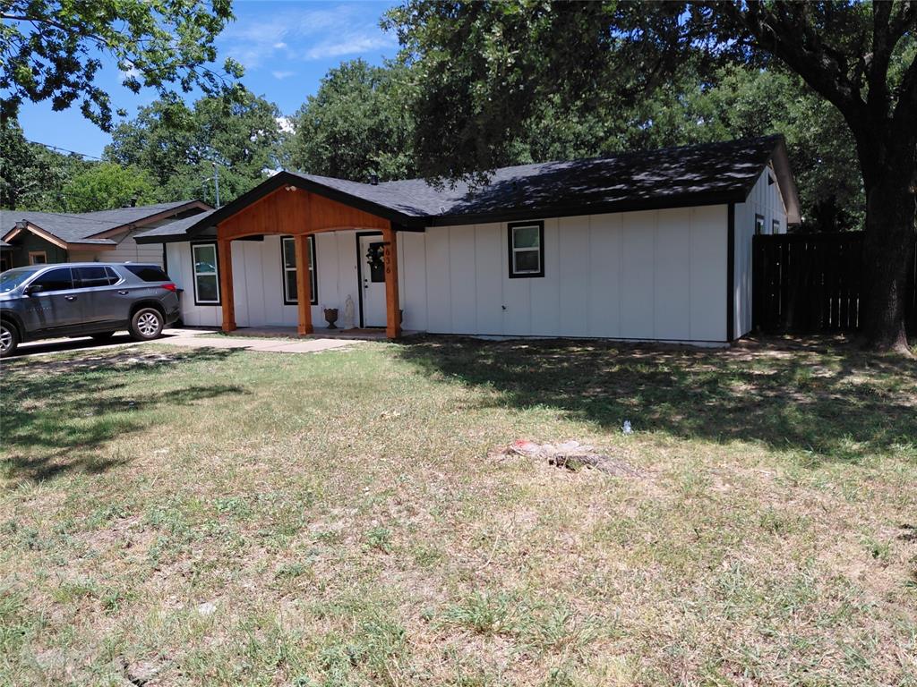 636 Clearfield Road Dallas, TX 75217 - Photo 9 of 10 White vertical siding exterior with black trim windows