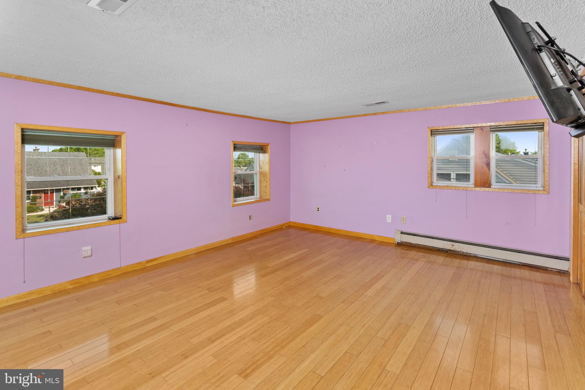 23 Cotton Road Levittown, PA 19057 - Photo 22 of 36 a view of an empty room with a window