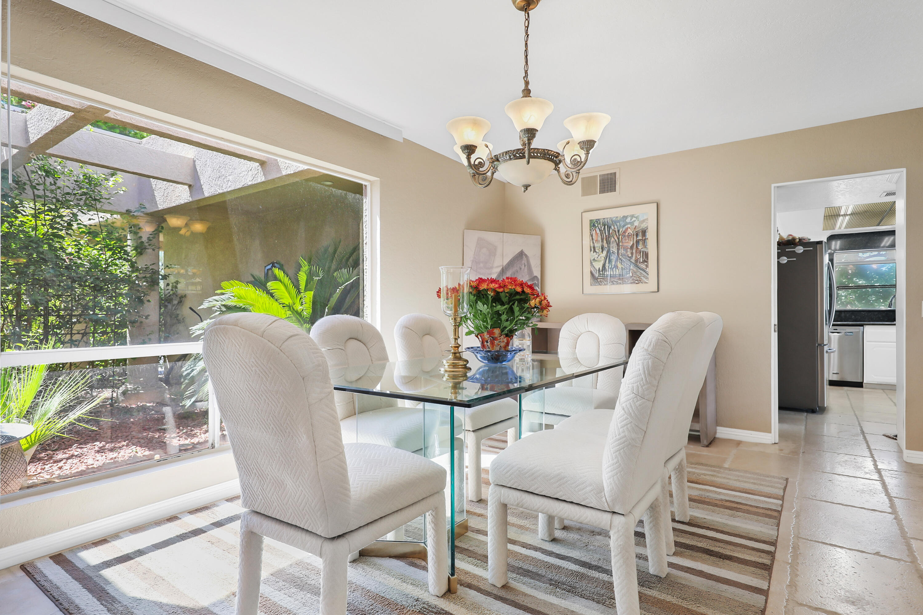 78950 Starlight Lane Bermuda Dunes, CA 92203 - Photo 11 of 40 a dining room with furniture potted plants and wooden floor
