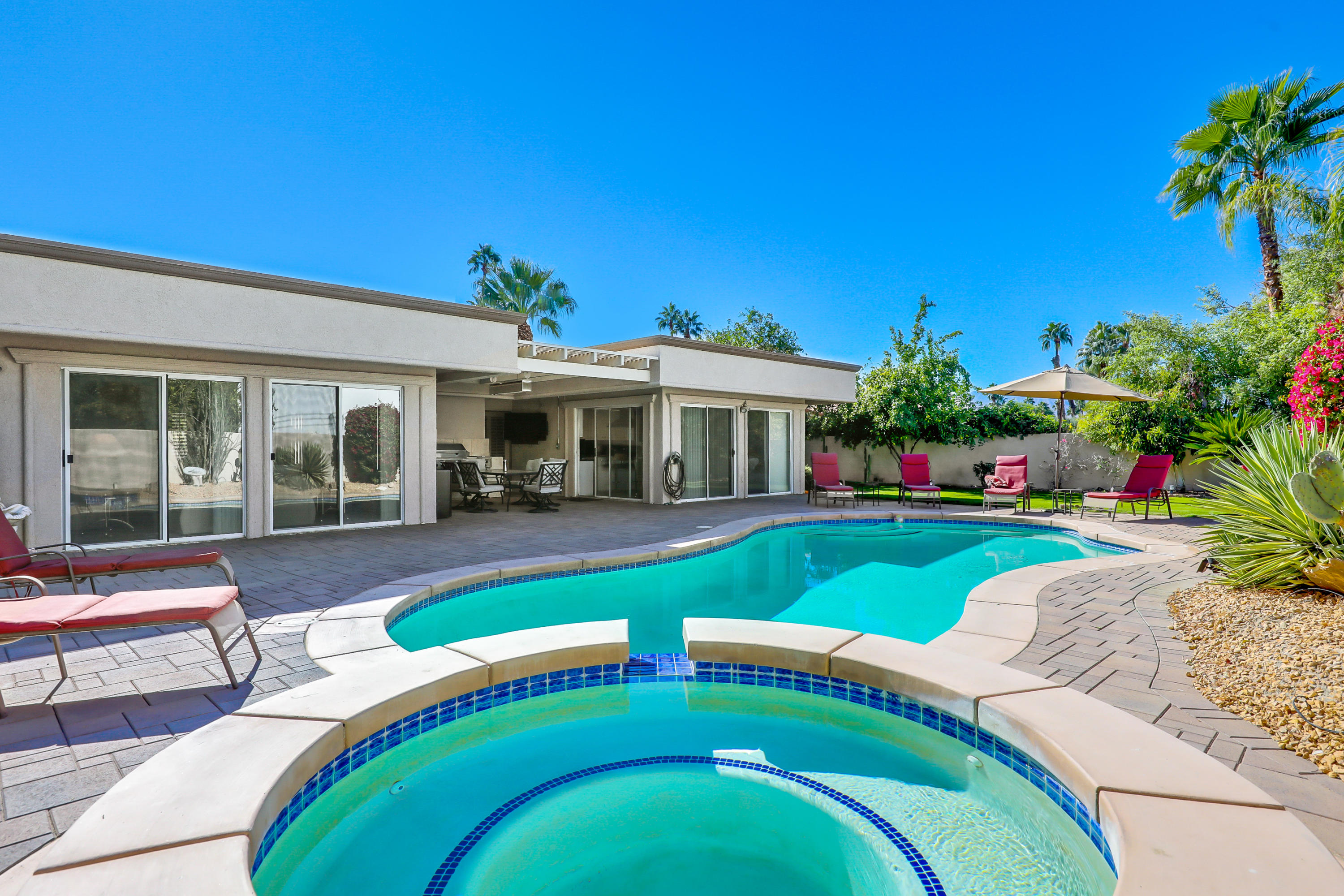 78950 Starlight Lane Bermuda Dunes, CA 92203 - Photo 2 of 40 a view of a house with a swimming pool