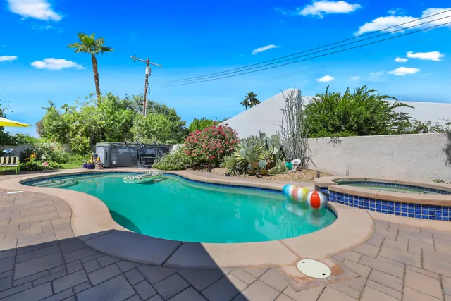 a view of a swimming pool with a patio