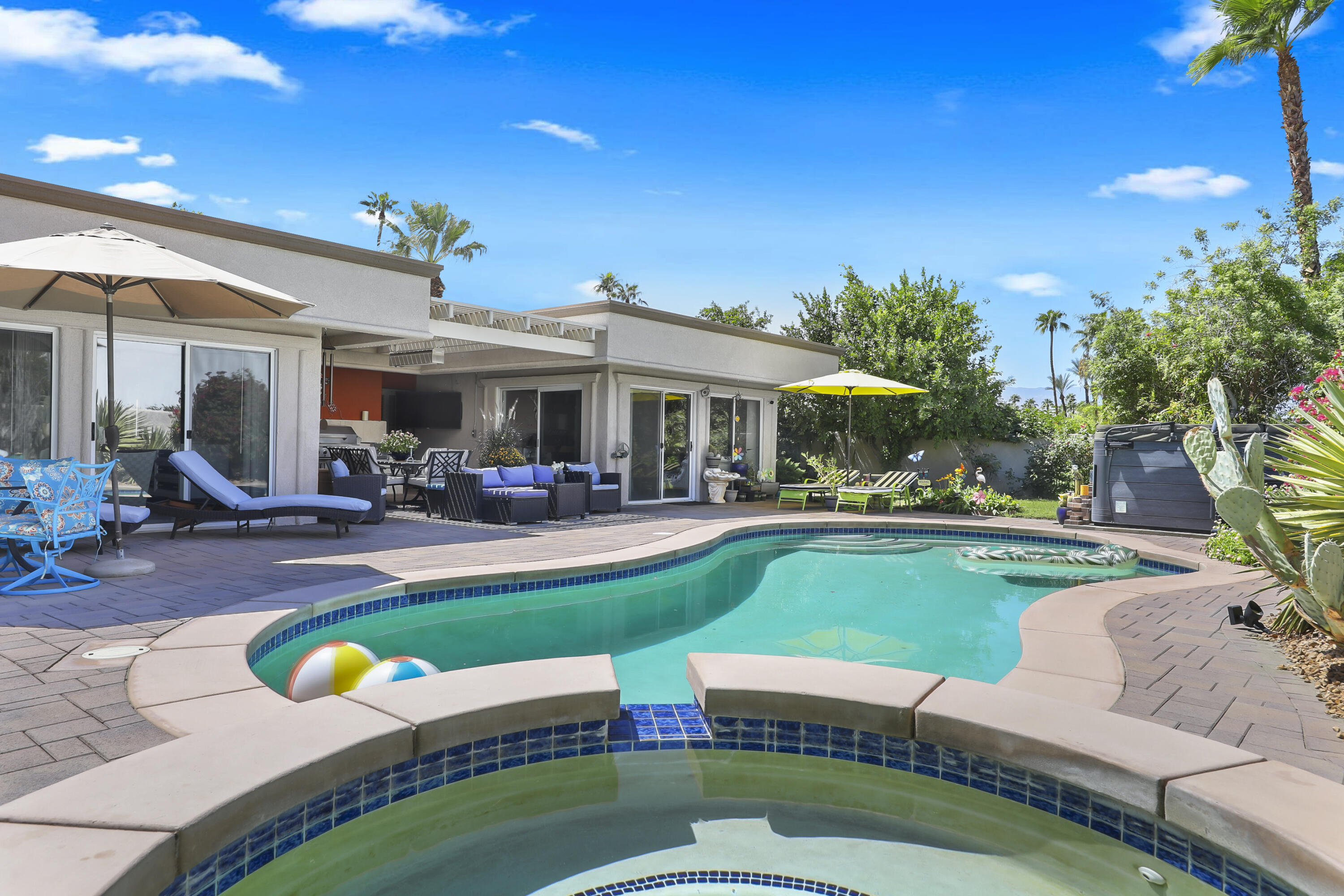 78950 Starlight Lane Bermuda Dunes, CA 92203 - Photo 31 of 40 a view of a house with swimming pool and porch
