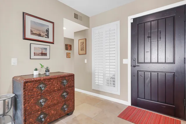 a bed room with a bed and a window