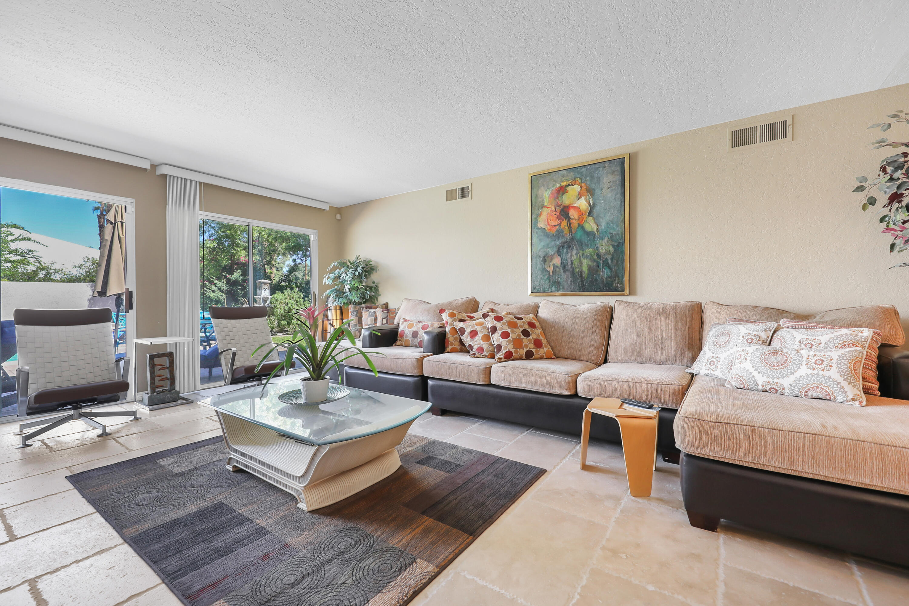 78950 Starlight Lane Bermuda Dunes, CA 92203 - Photo 6 of 40 a living room with furniture a rug and a large window
