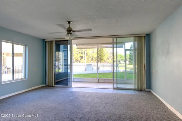a view of an empty room with a window