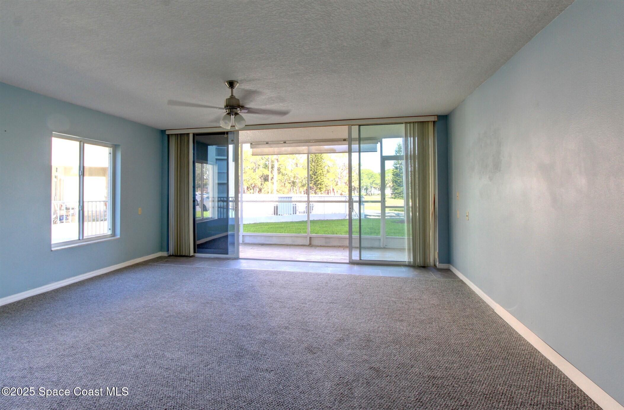 1420 Huntington Lane, Unit 2101 Rockledge, FL 32955 - Photo 15 of 38 a view of an empty room with a window
