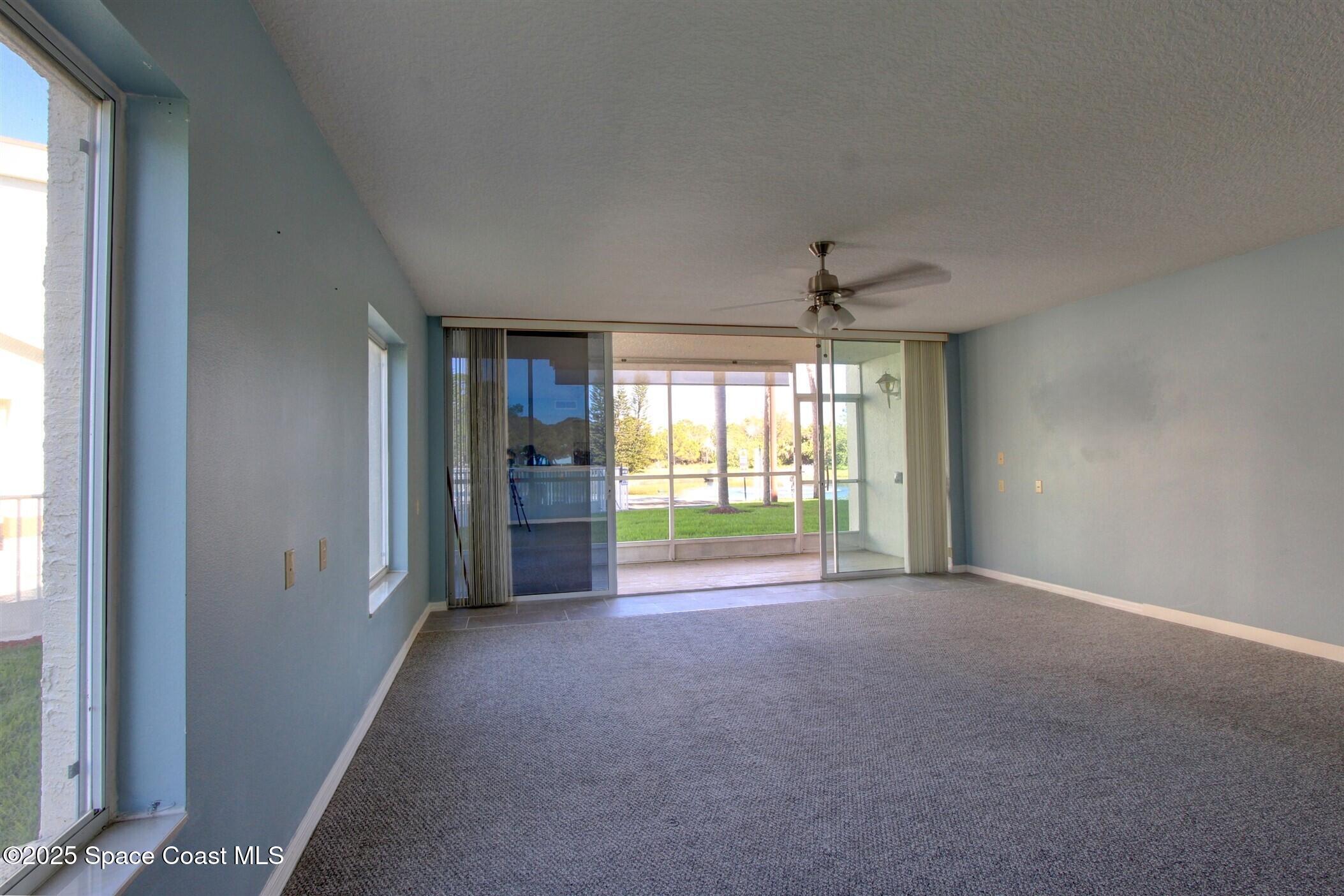 1420 Huntington Lane, Unit 2101 Rockledge, FL 32955 - Photo 16 of 38 a view of an empty room with a window