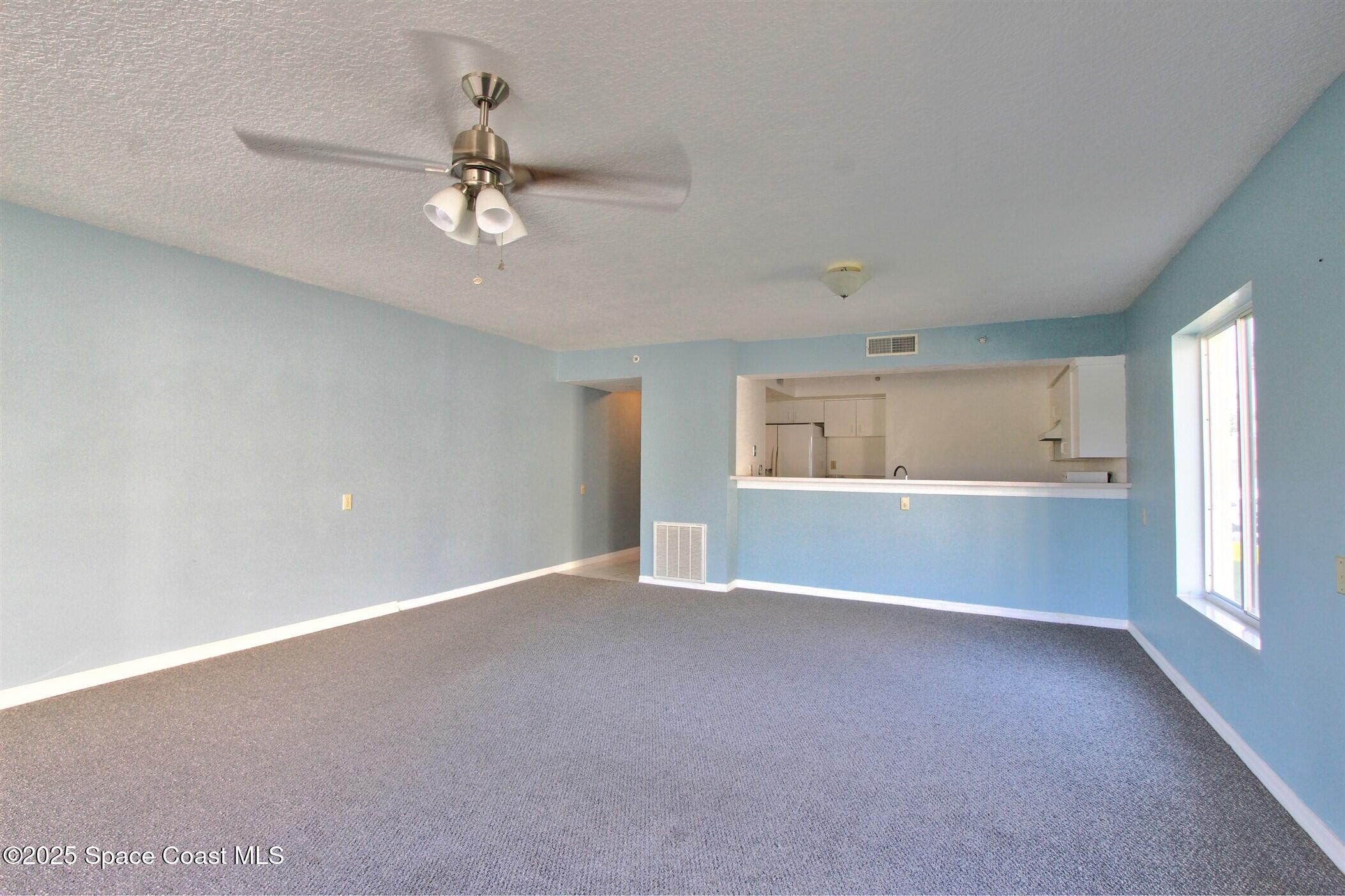 1420 Huntington Lane, Unit 2101 Rockledge, FL 32955 - Photo 17 of 38 a view of an empty room with a window