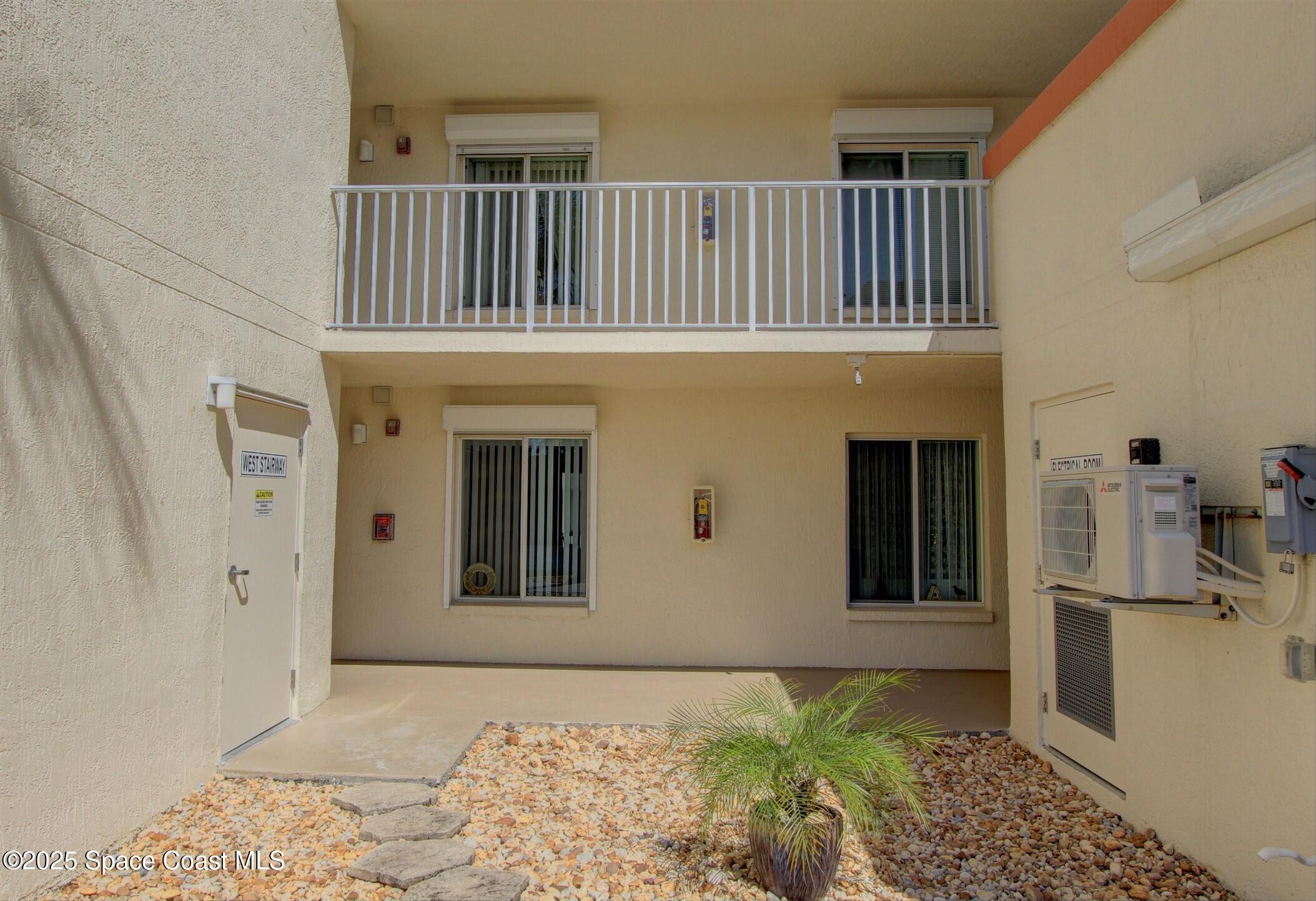 1420 Huntington Lane, Unit 2101 Rockledge, FL 32955 - Photo 19 of 38 a view of a hallway with entryway and front door