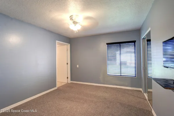 a view of a livingroom with a staircase