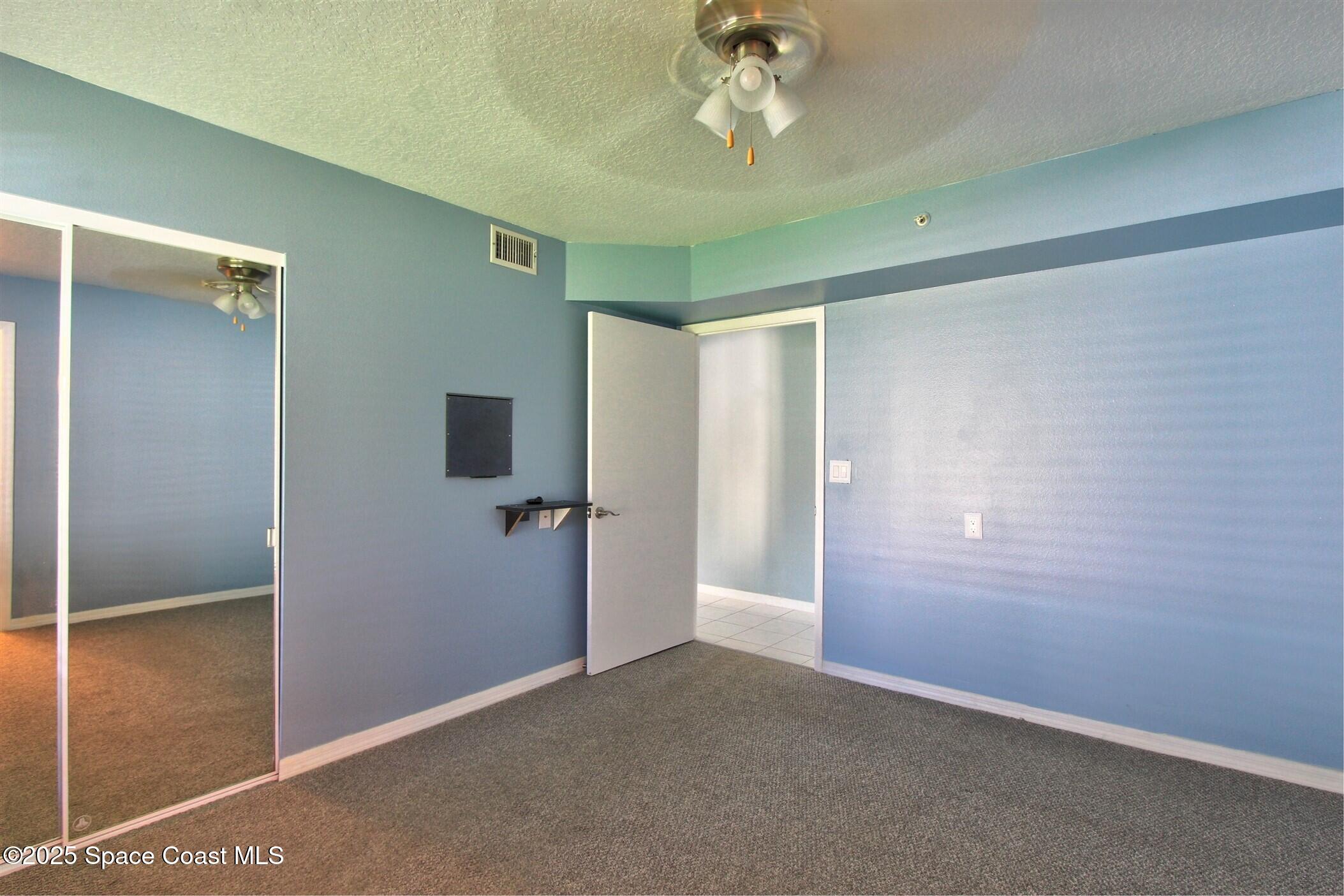 1420 Huntington Lane, Unit 2101 Rockledge, FL 32955 - Photo 27 of 38 a view of a big room with closet area