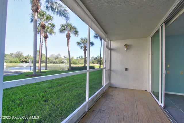 a front view of a building with a yard