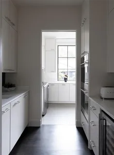 a kitchen with a cabinets a sink and a stove