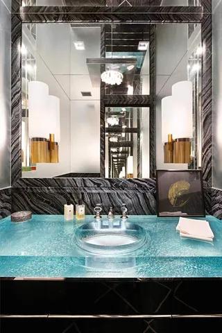 a view of a bathroom with a tub and windows