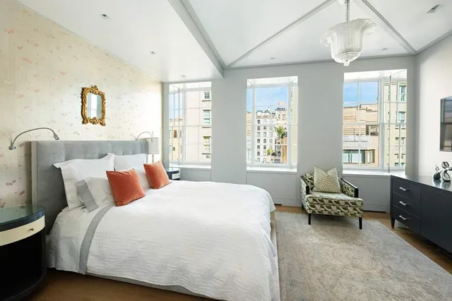 a spacious bathroom with a double vanity sink mirror and toilet