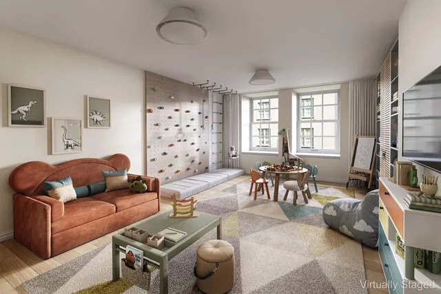 a view of a tall building next to a road