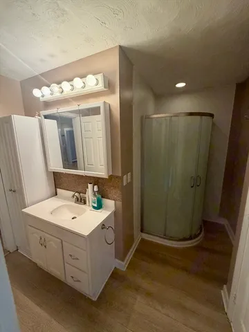 a bathroom with a double vanity sink and mirror