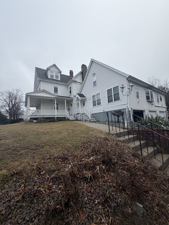 18 Avon Street, Unit B Reading, MA 01867 - Photo 2 of 14 a view of a house with a yard