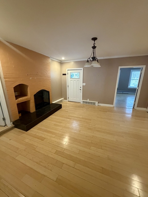 18 Avon Street, Unit B Reading, MA 01867 - Photo 4 of 14 a view of a livingroom with a fireplace
